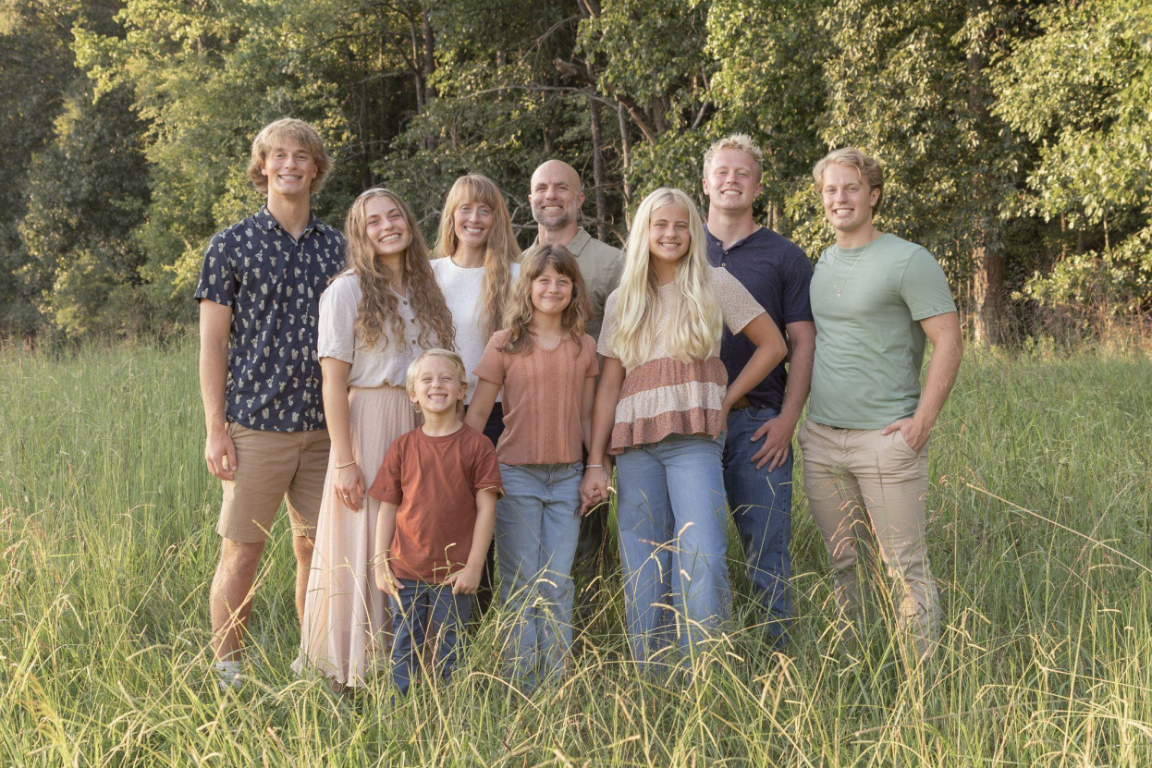 The Griffin family gathered together outdoors